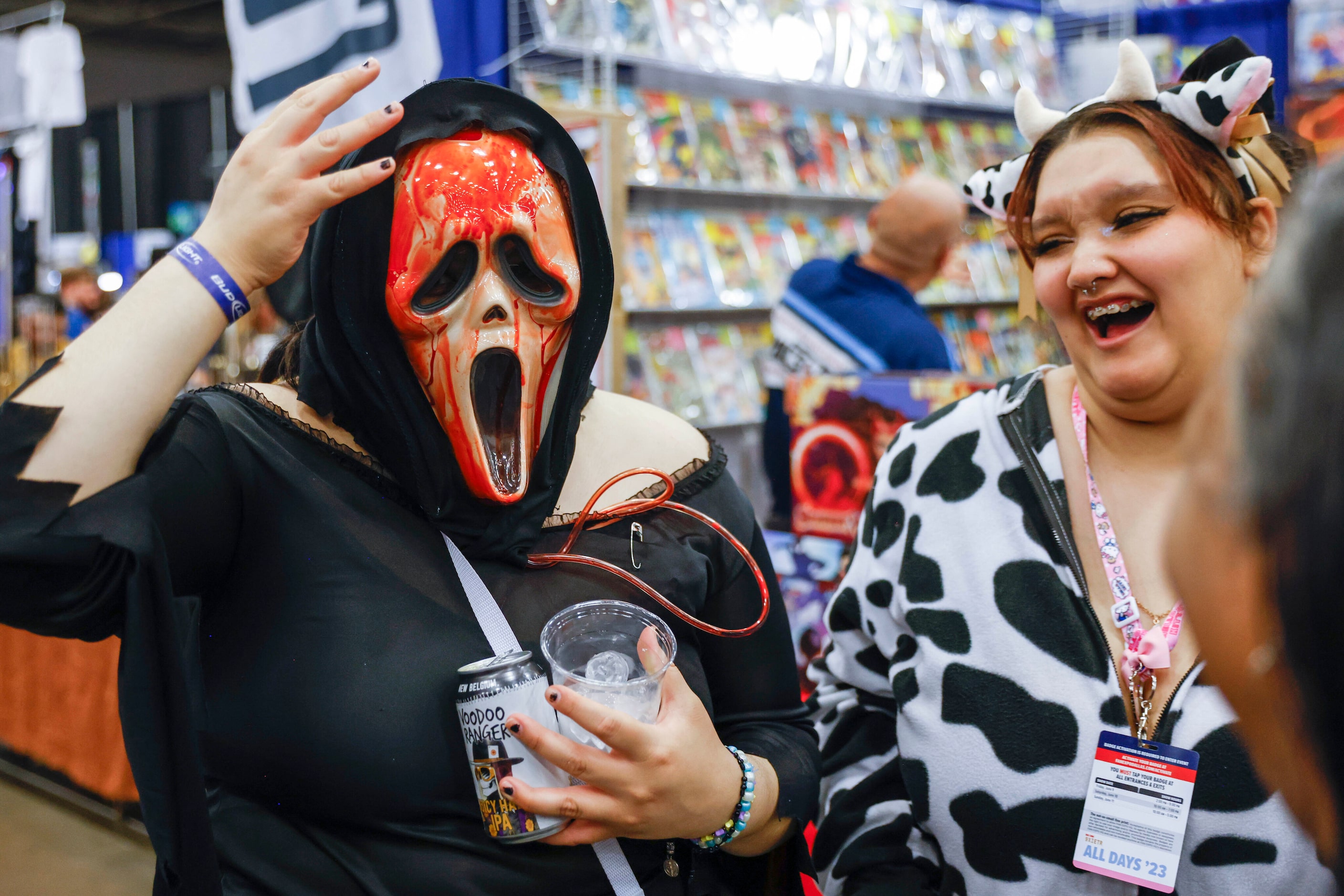 Xolo Martinez (left) of Fort Worth adjusts her masks as Cecilia Pineda reacts during Fan...