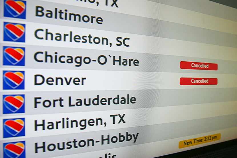 A flight status board at Dallas Love Field shows where the biggest air travel disruptions...