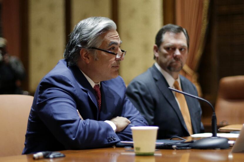 University of Texas System Chancellor Francisco Cigarroa, left, listens to a question as...
