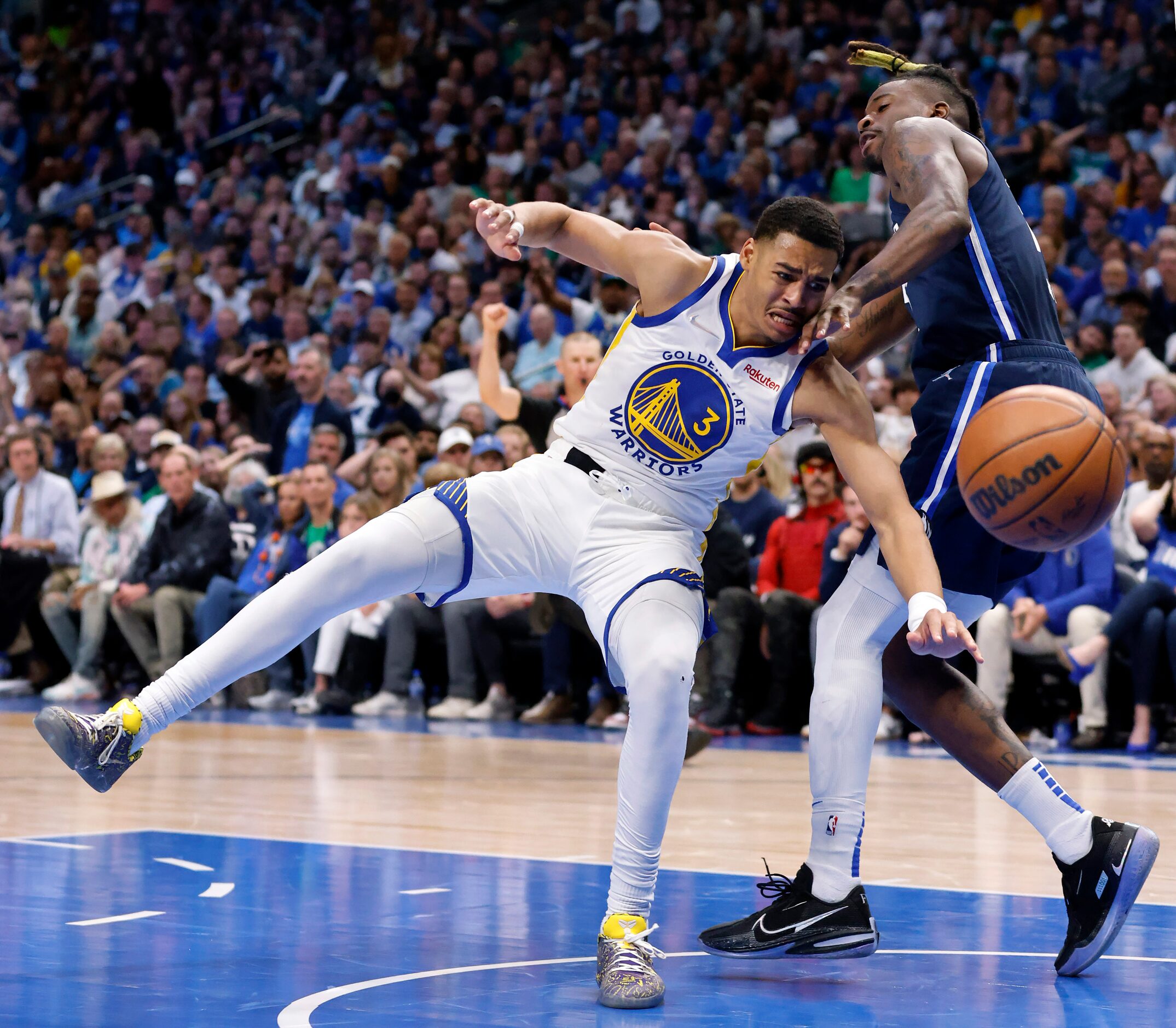 Dallas Mavericks forward Reggie Bullock (25) tackles Golden State Warriors guard Jordan...