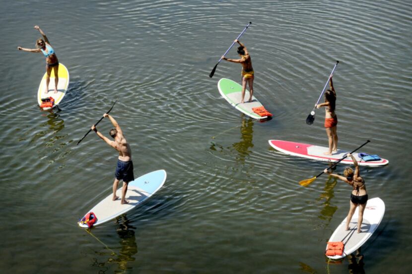Stand-up paddleboard yoga is the newest thing.  These people are on the Clark Fork River in...