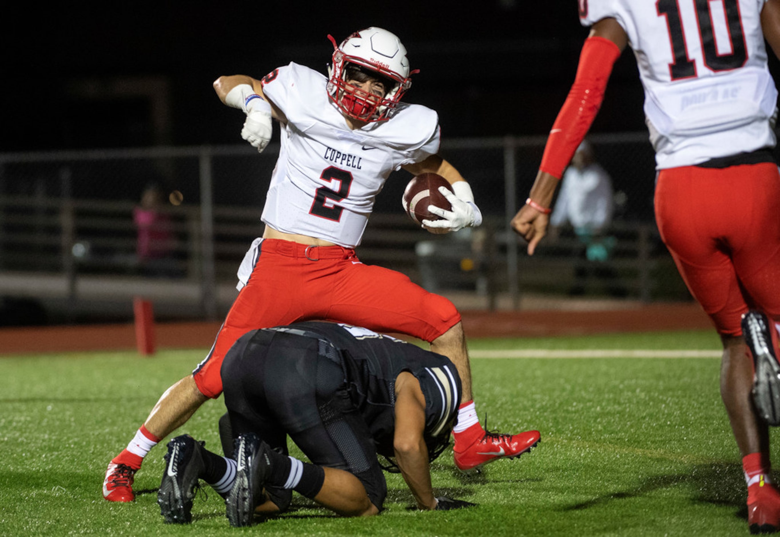 Coppell senior running back Tanner Woodby (2) celebrates after scoring a touchdown past...