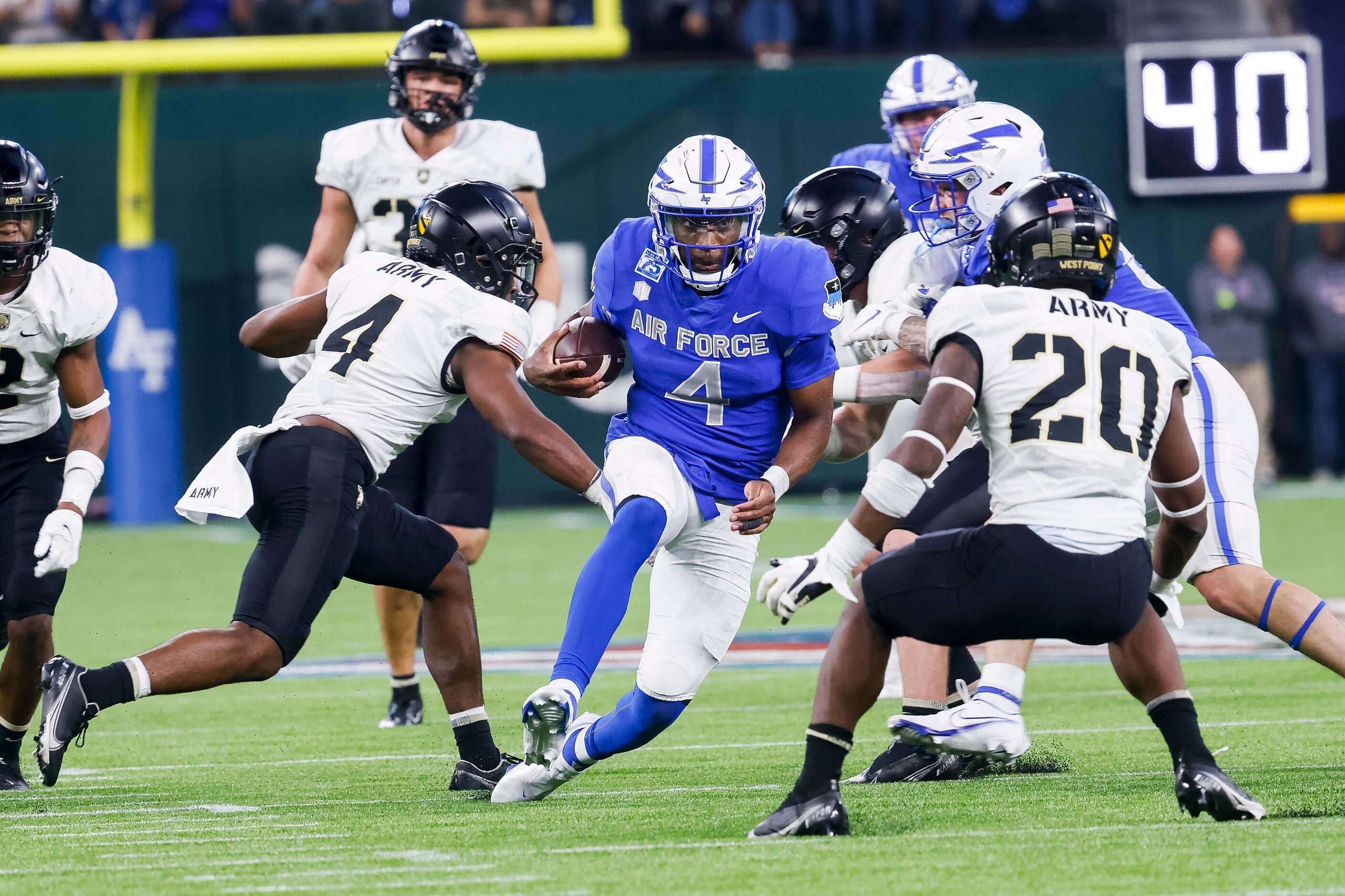 Air Force Falcons quarterback Haaziq Daniels (4) runs through the Army Black Knights defense...