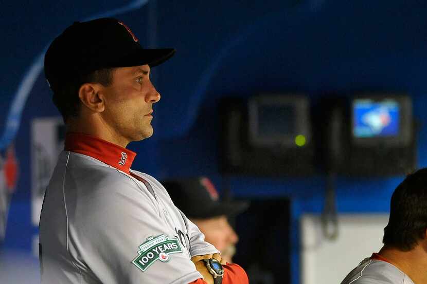 TORONTO, CANADA - APRIL 9:  Bench coach Tim Bogar #17 of the Boston Red Sox looks on from...