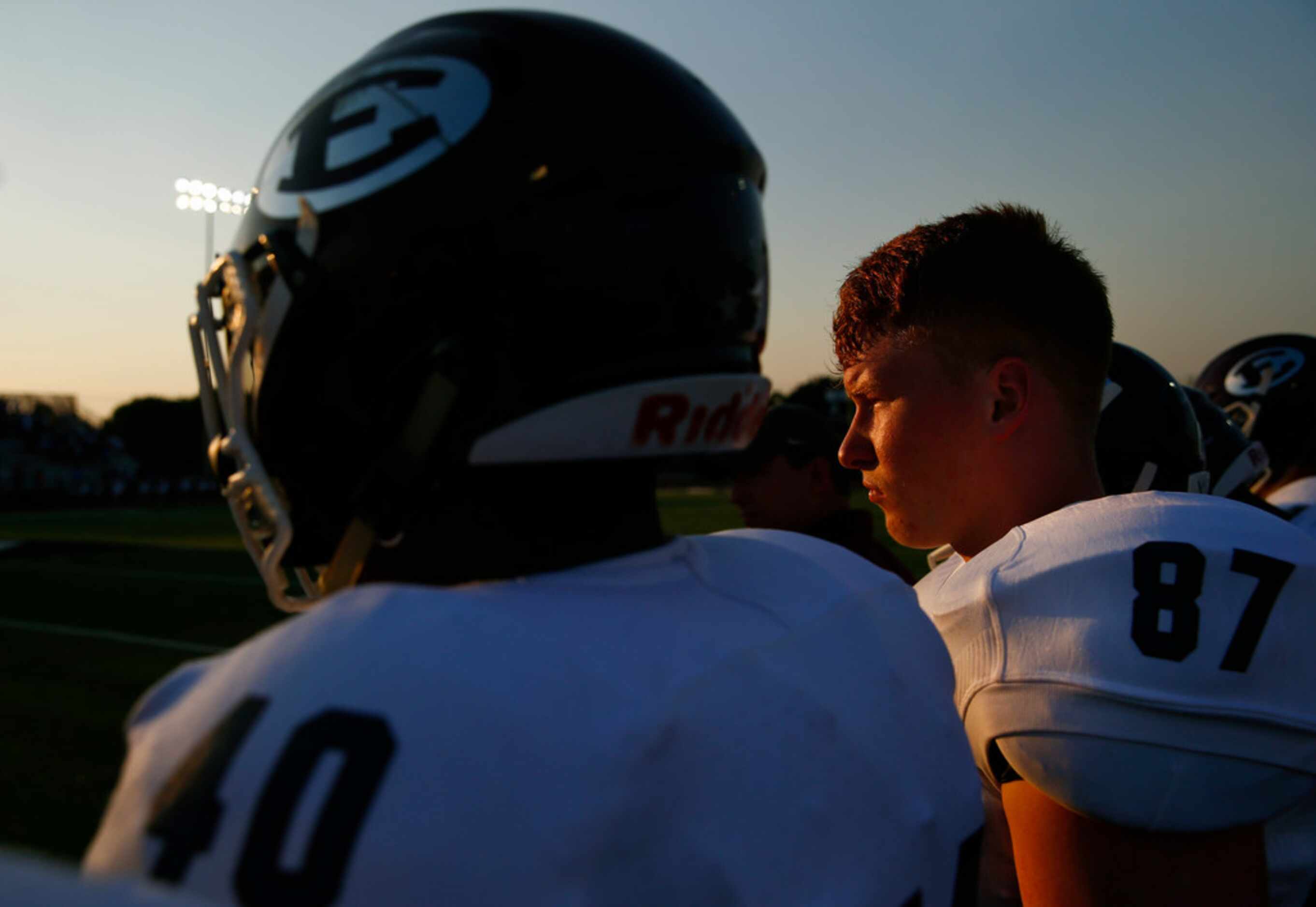 Ennis offensive lineman Dominik Rankin (87) and tight end Michael Collins (4) watch a play...