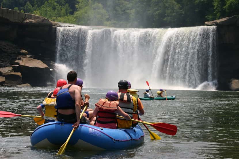 Visitors enjoy rafting near the base of Cumberland Falls in Kentucky.