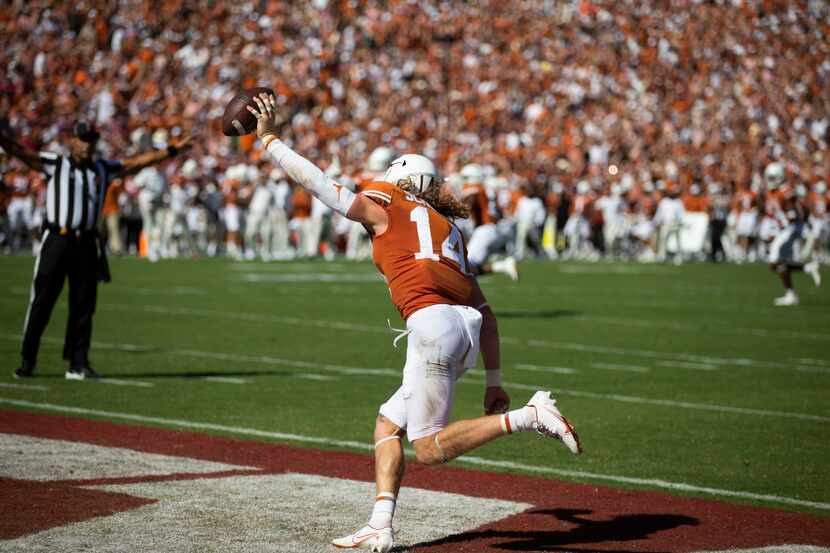 Texas defensive back Brenden Schooler (14) celebrates recovering a blocked Oklahoma punt...