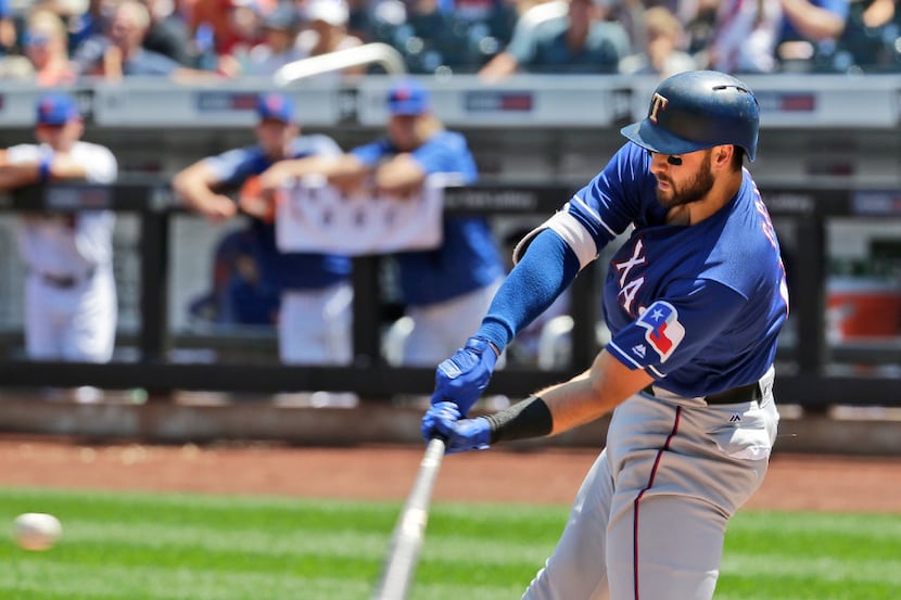 Texas Rangers' Joey Gallo hits a two-run home run during the first inning of a baseball game...