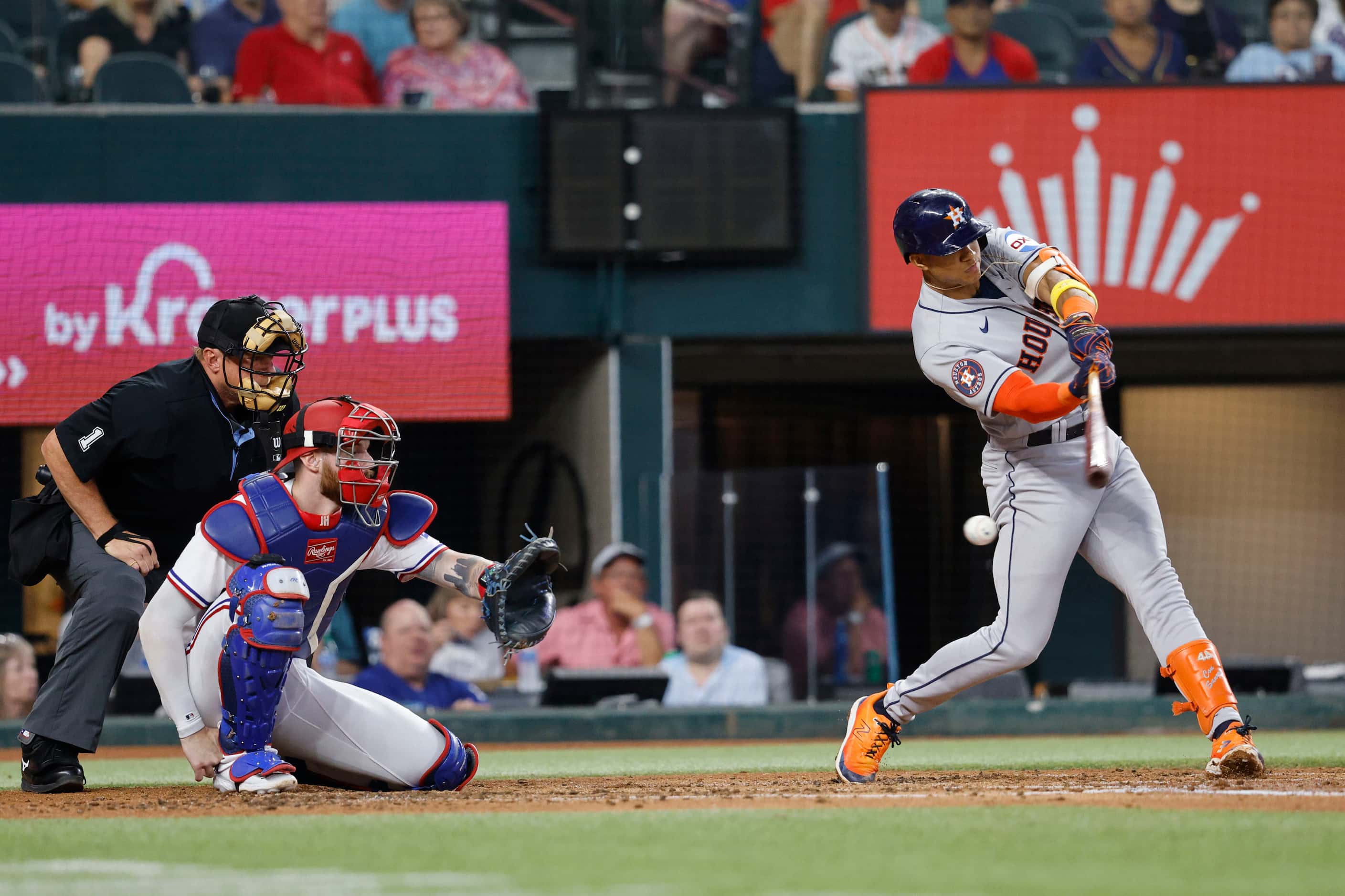 Houston Astros shortstop Jeremy Pena (3) swings as Texas Rangers catcher Jonah Heim (28) is...