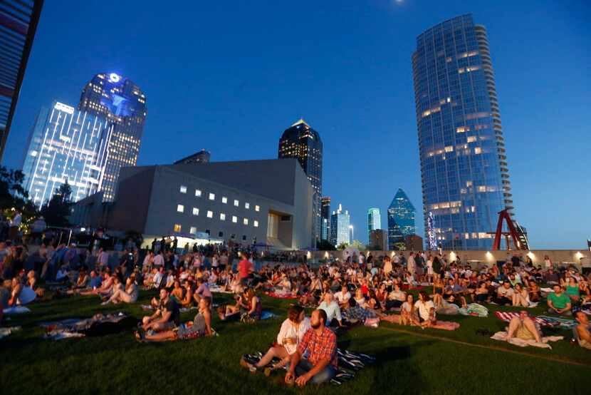 People wait for Dawes to perform at Strauss Square in Dallas, Texas on Wednesday, June 24,...