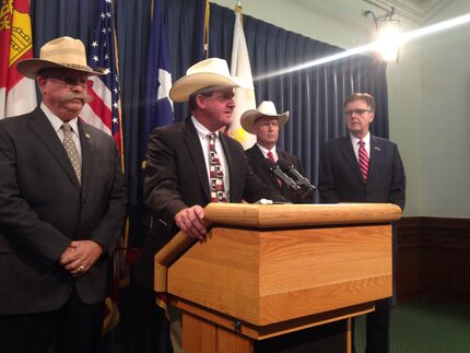  Personal photographer to former President George H.W. Bush, David Valdez (right) visits...