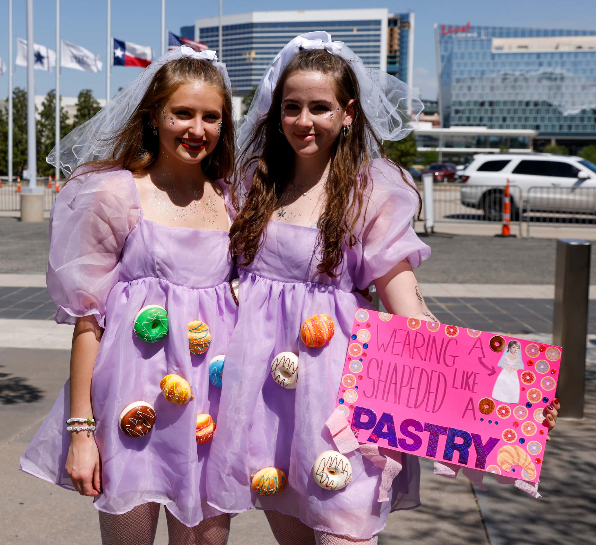 Abby Pickle, 17 (left), and Jayna Syrett, 17, pose for a portrait with their “Speak Now”...