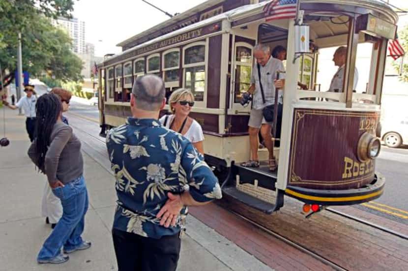 
Passengers easily take the Uptown trolley during the daytime, unlike the disruptions late...