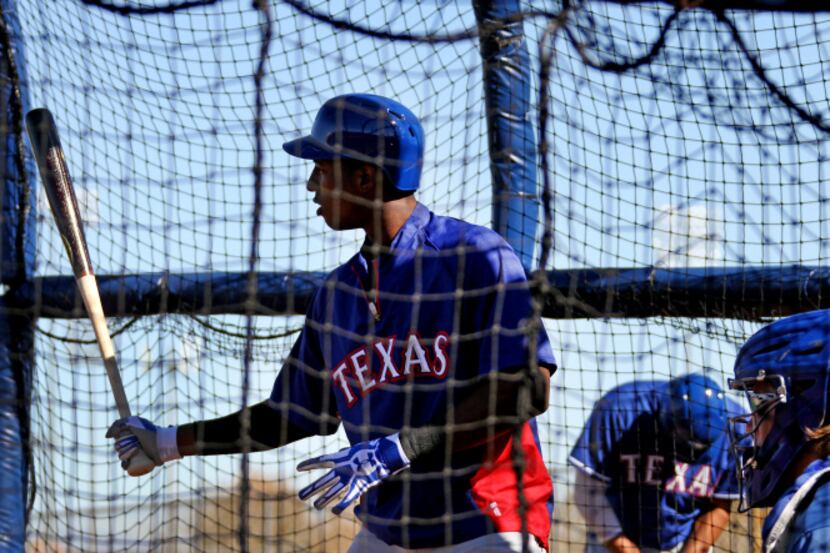 Texas infielder Jurickson Profar works in the batting cage at the Texas Rangers spring...