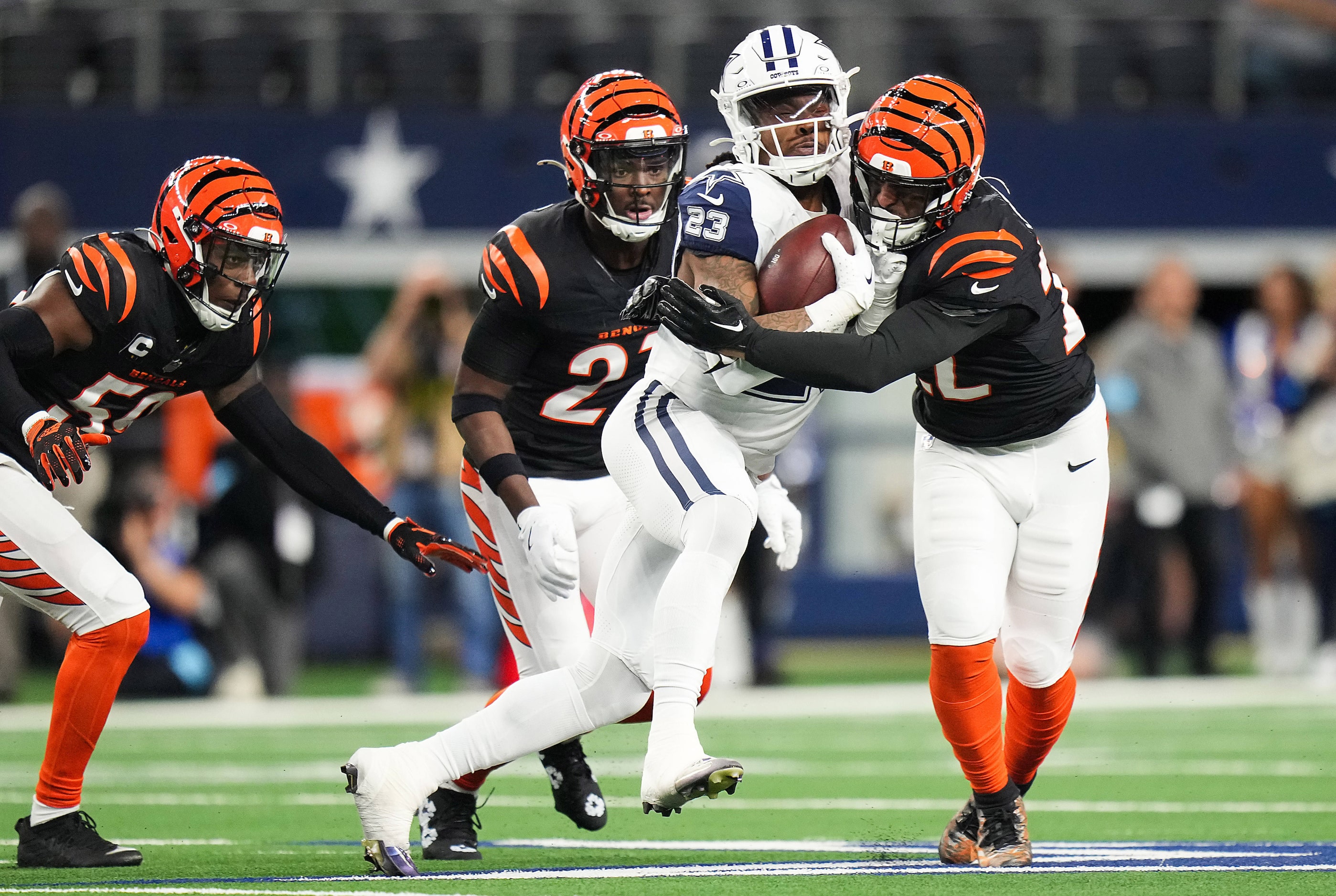 Dallas Cowboys running back Rico Dowdle (23) is brought down by Cincinnati Bengals safety...