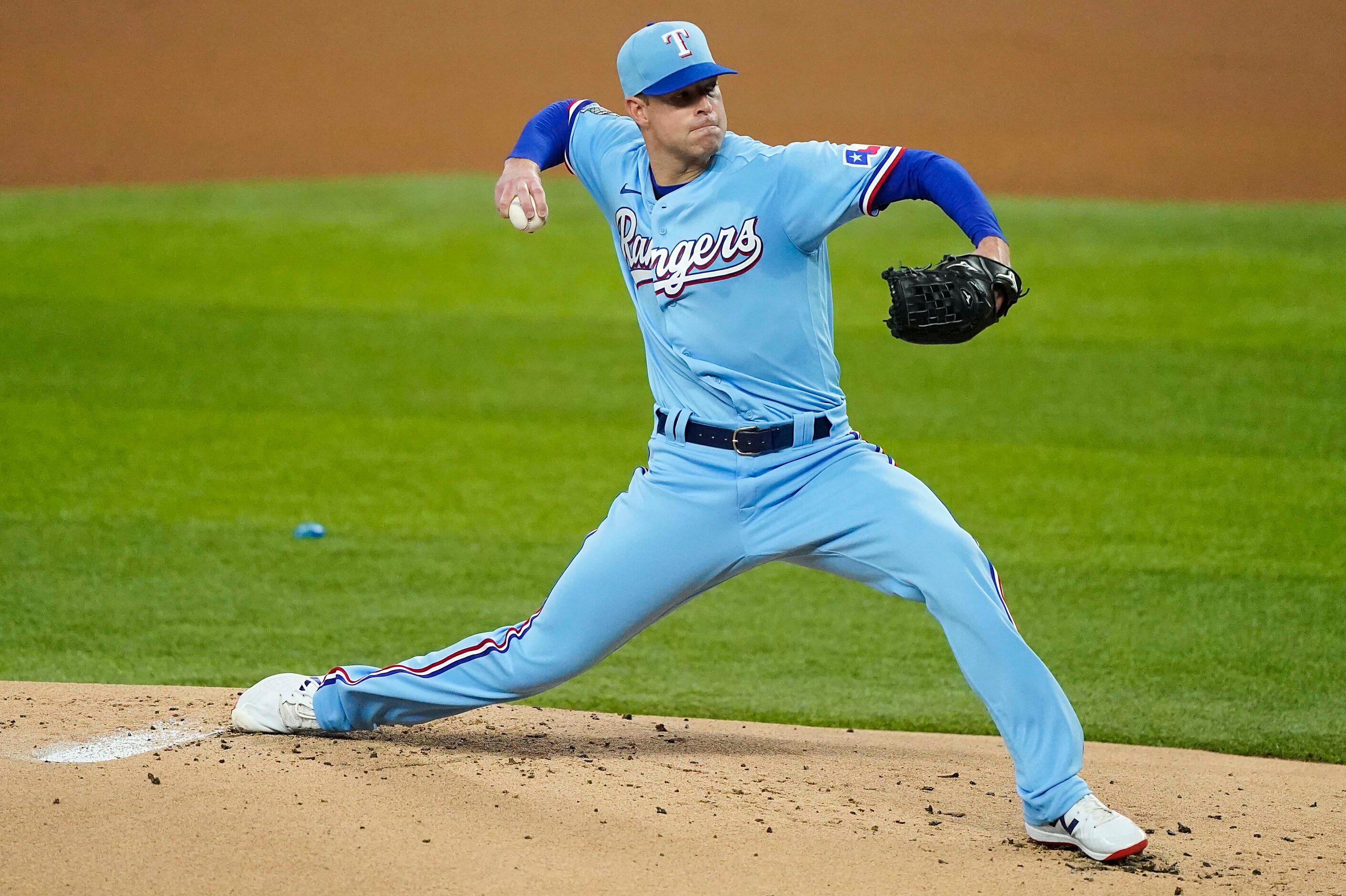 Texas Rangers pitcher Corey Kluber pitches during the first inning against the Colorado...