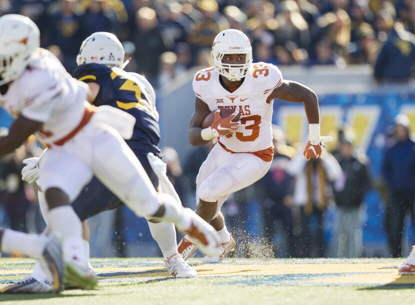 Nov 14, 2015; Morgantown, WV, USA; Texas Longhorns running back D'Onta Foreman runs the ball...