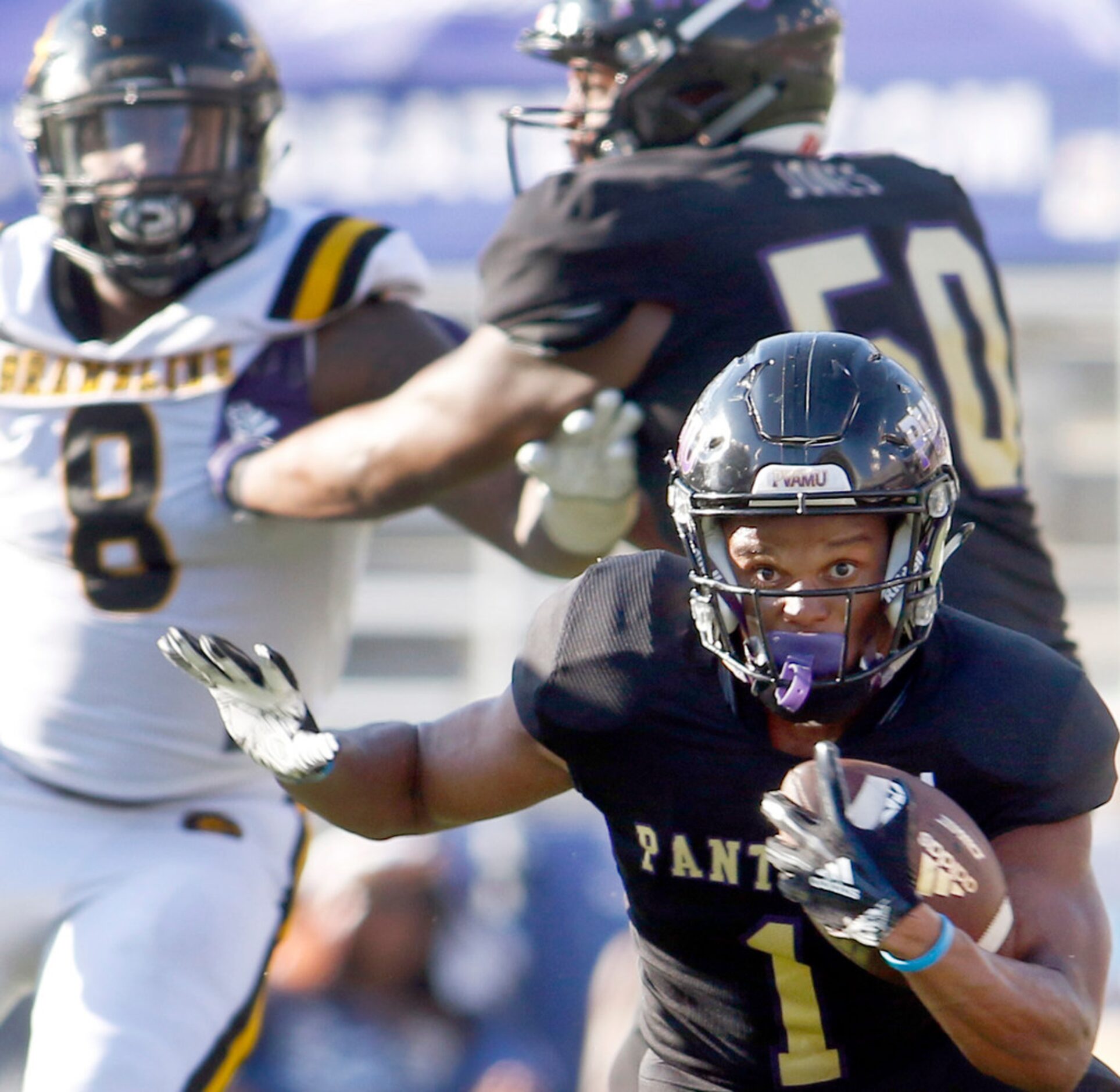 Prairie View running back Dawonya Tucker (1) looks for running room during a first half rush...