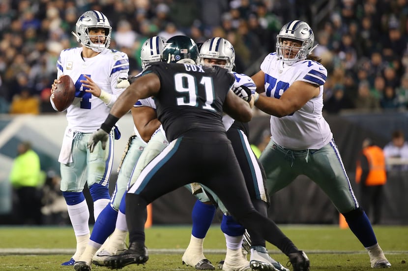 Dallas Cowboys offensive lineman protect Dallas Cowboys quarterback Dak Prescott (4) as he...