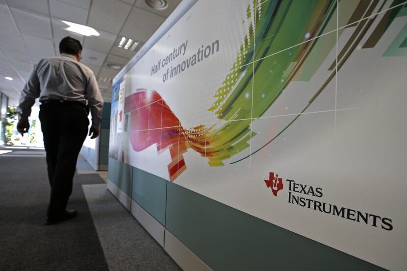 A person walks inside the research building of US tech firm Texas Instruments, Tuesday, Dec....