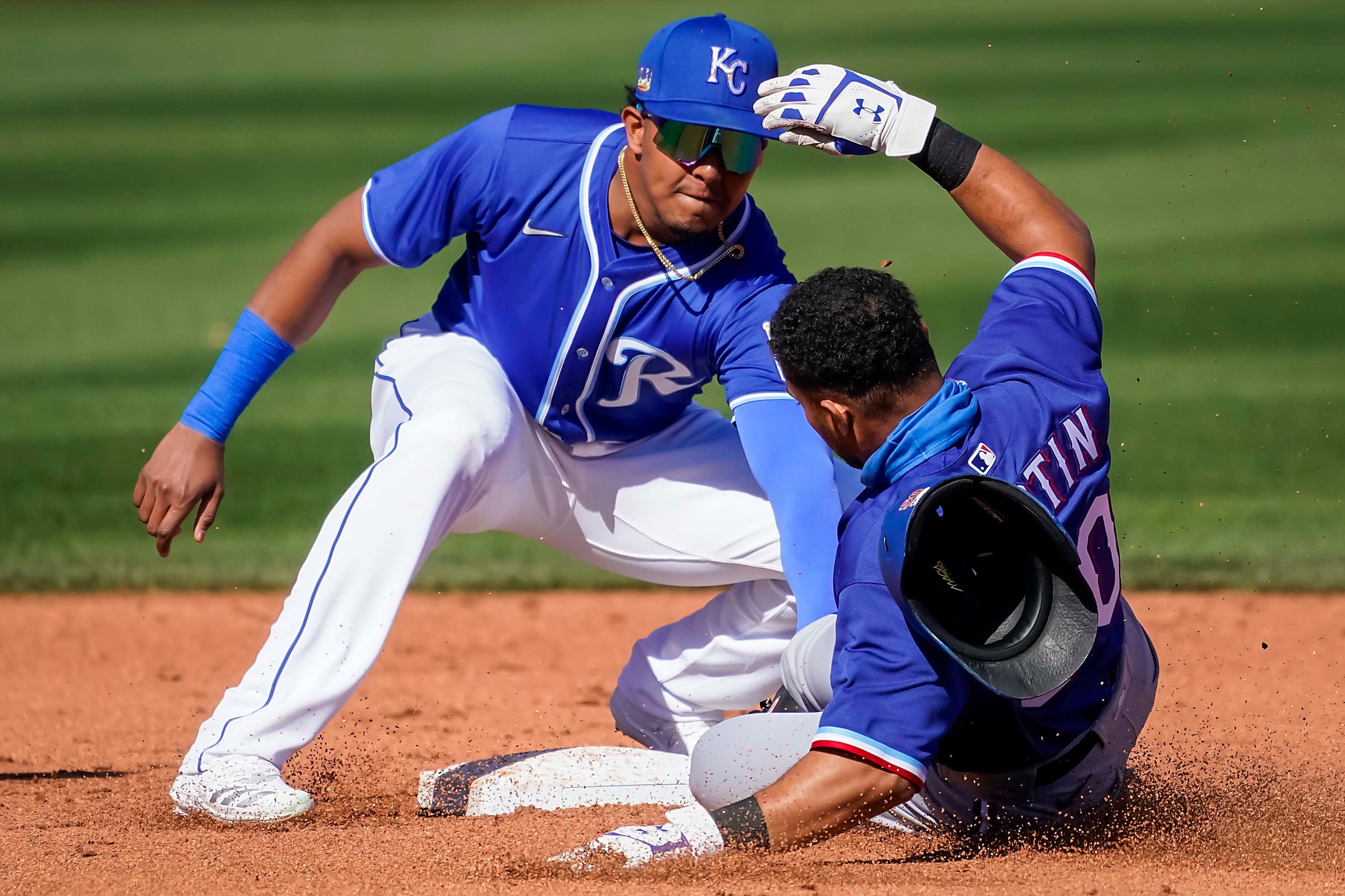 Texas Rangers outfielder Jason Martin is out at second base as Kansas City Royals second...