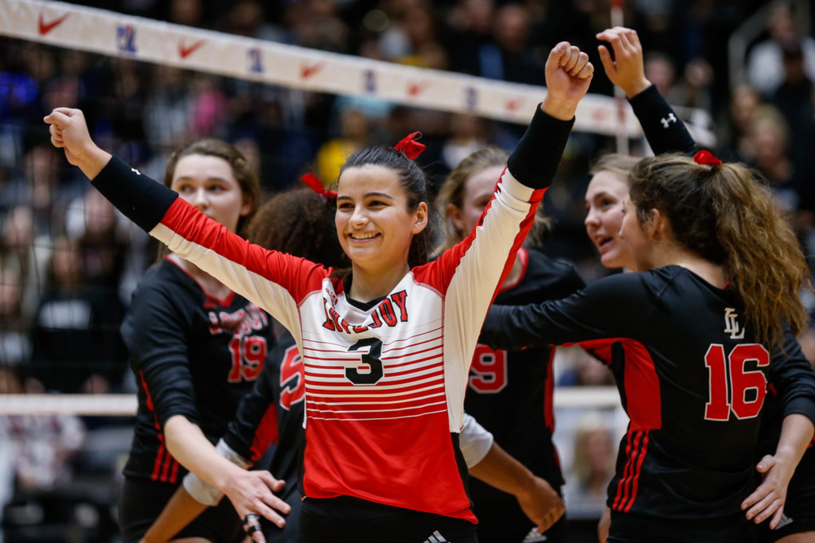 LovejoyÃs Callie Kemohah  (3) celebrates after scoring in the third set of a class 5A...