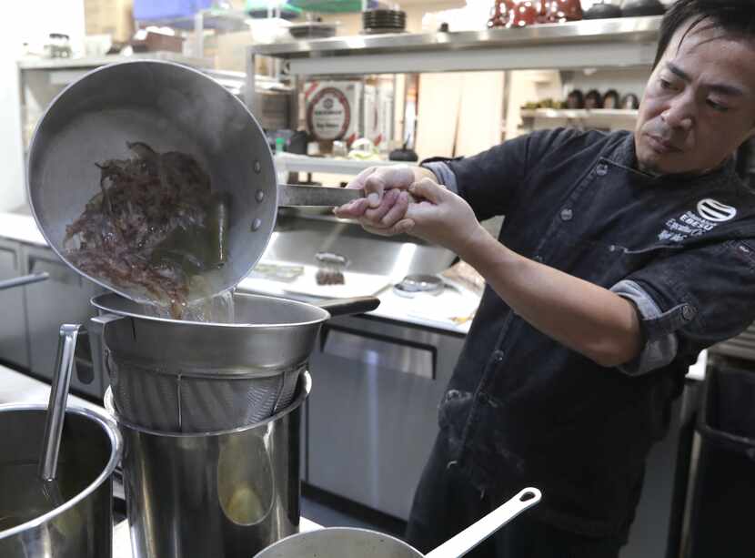 Chef Koji Yoshida demonstrates the process for making Dashi at Ebesu in Plano.