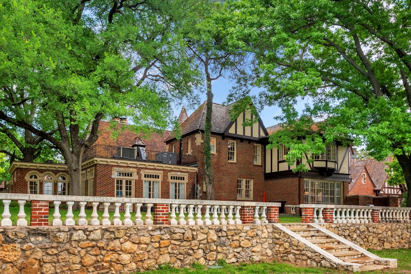 A view of the home from the backyard shows the terraced outdoor spaces and the beauty of the...