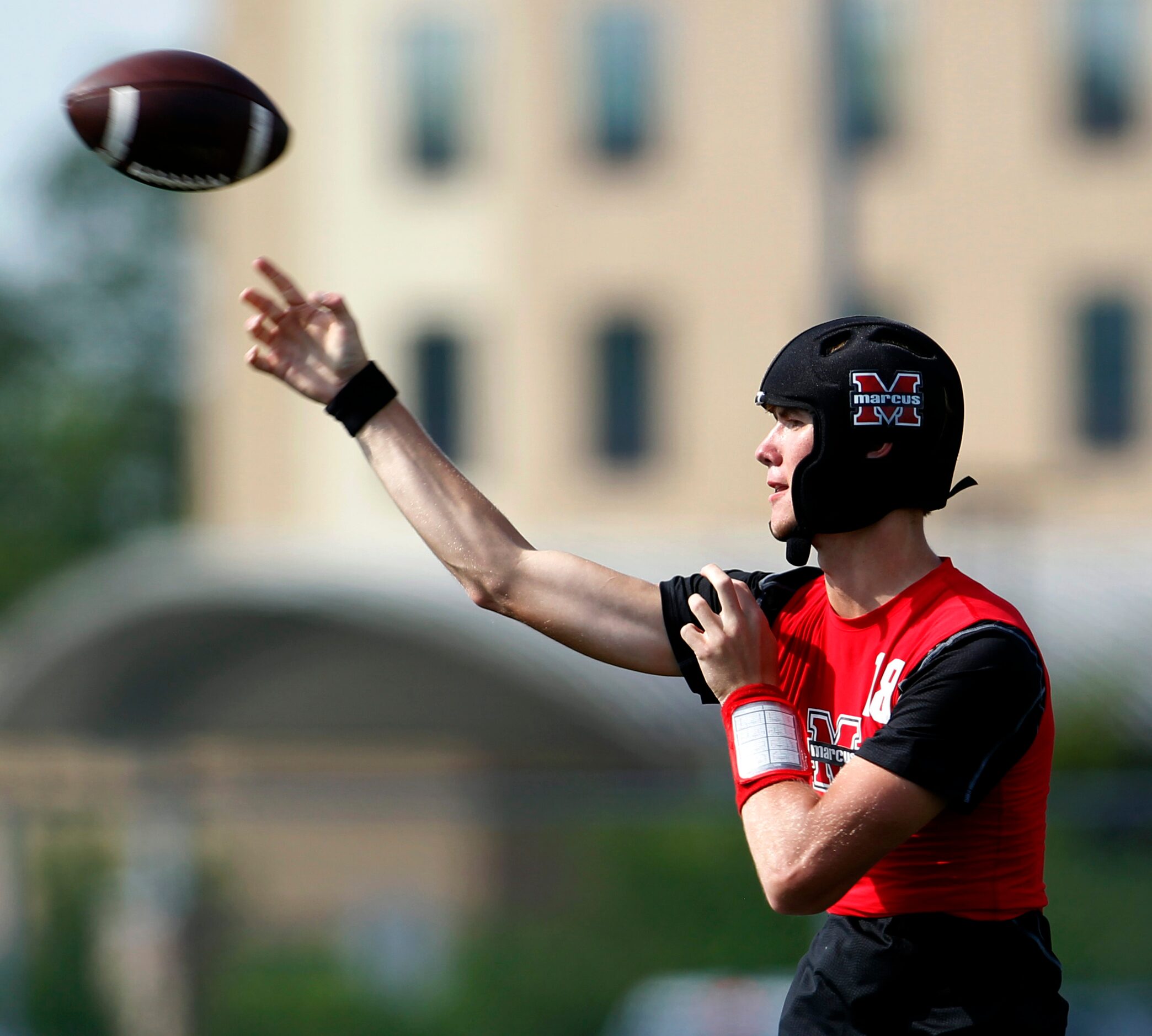 Flower Mound Marcus quarterback Cole Welliver (18) delivers a pass downfield during day 1...