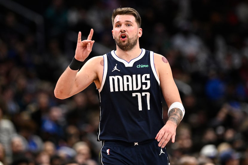 Dallas Mavericks guard Luka Doncic (77) gestures during the second half of an NBA basketball...