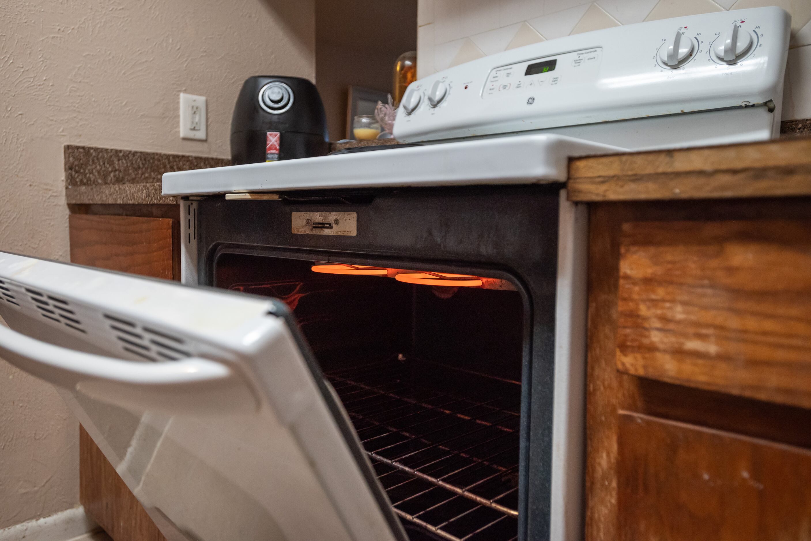 Brittany Jones uses her kitchen oven to keep her home warm on Saturday morning, Feb. 12,...