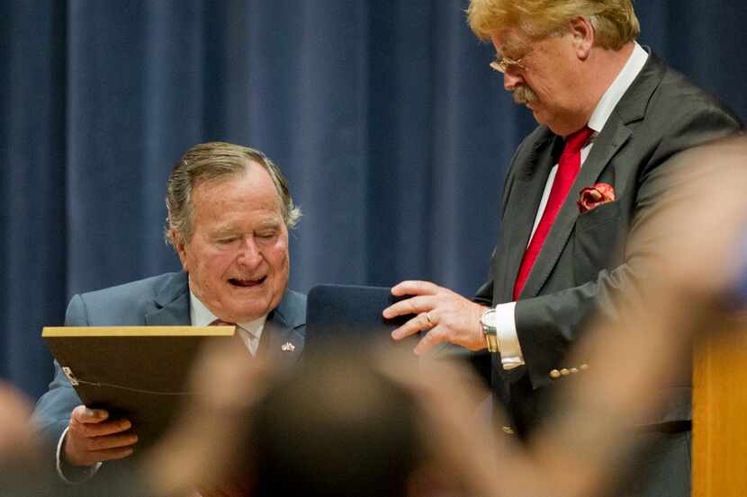 George H.W. Bush receives the Schuman Medal from Elmar Brok, Chairman of the European...
