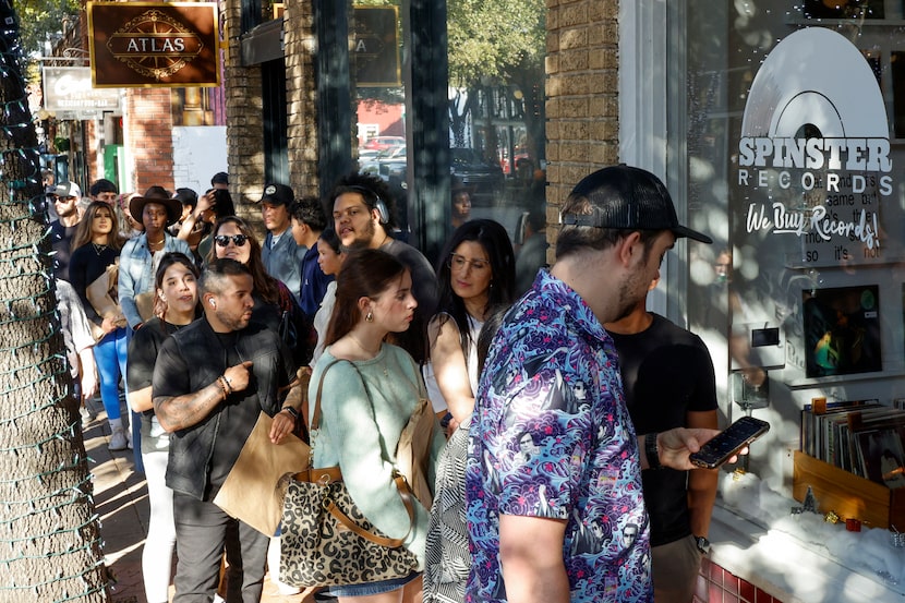 People wait in line for a Leon Bridges album signing event at Spinster Records in Bishop...