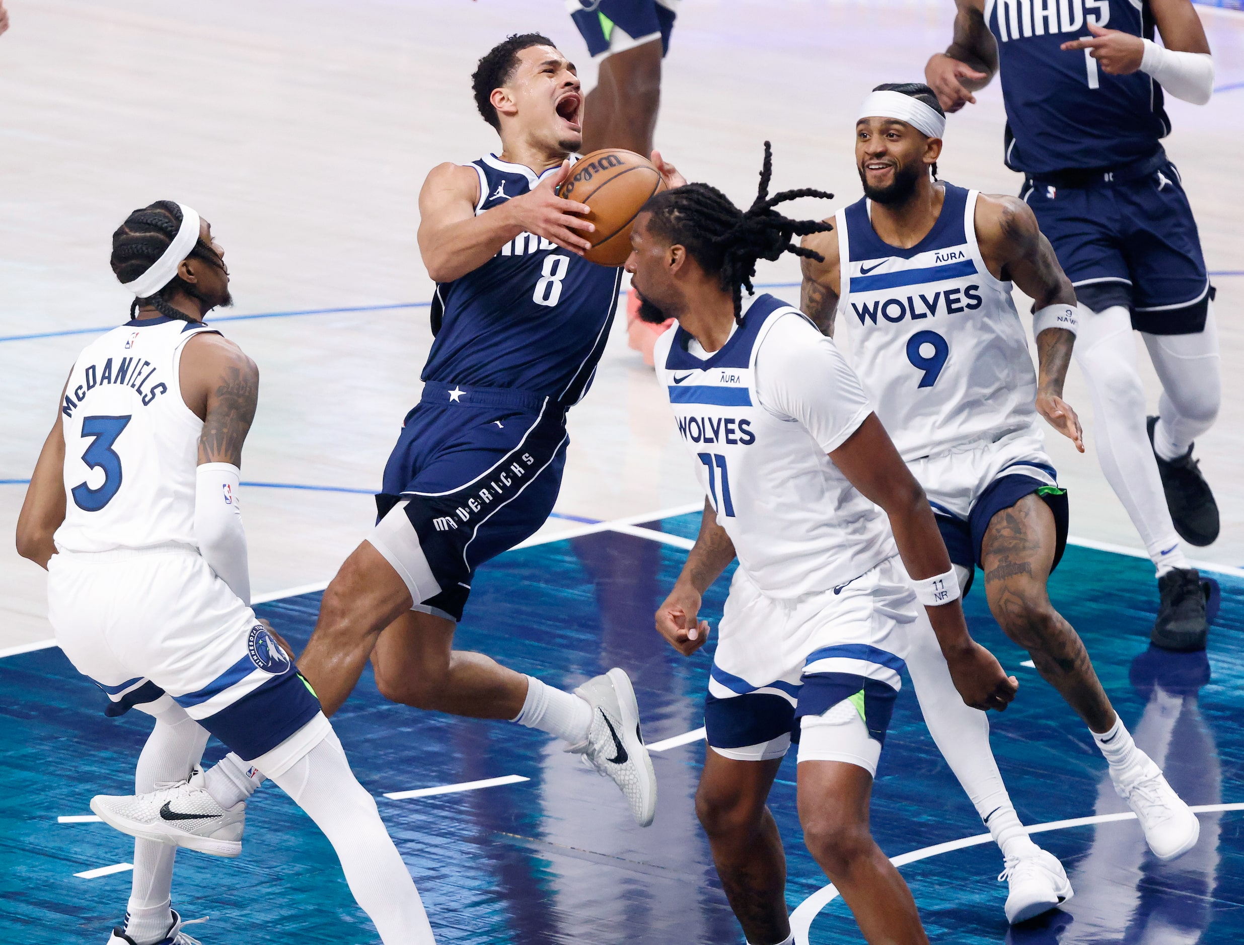 Dallas Mavericks guard Josh Green (8) puts up a shot as he’s fouled by Minnesota...