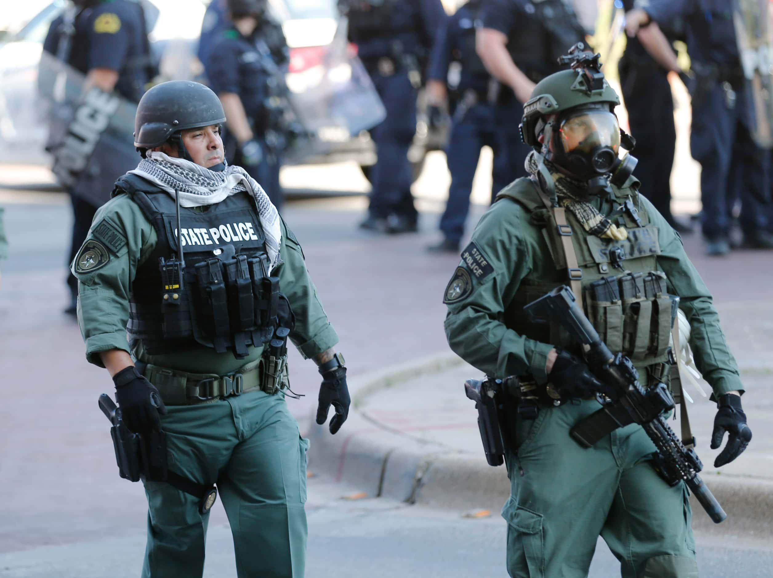 Texas state police make their way on the scene as protesters rally during a demonstration...