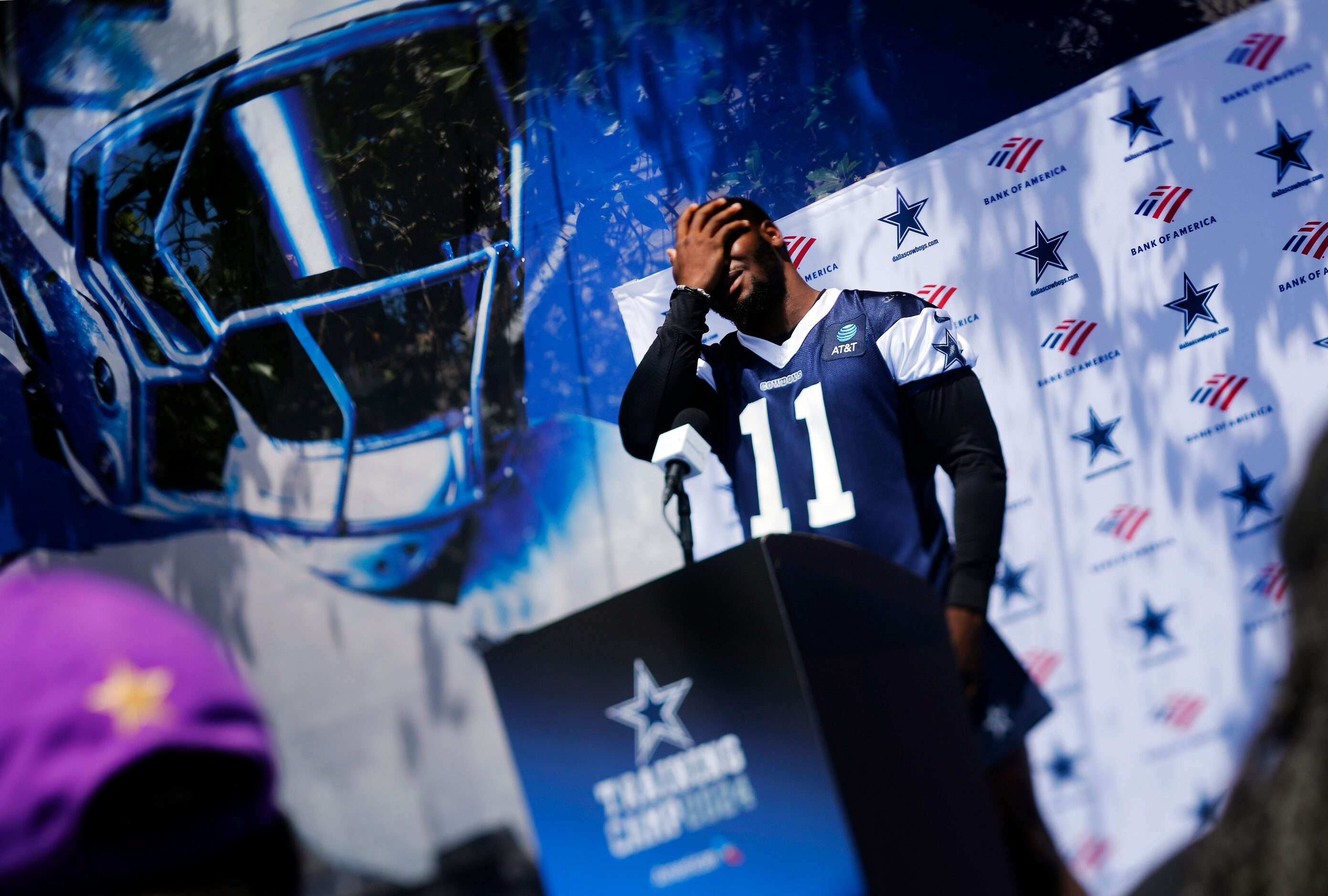 Dallas Cowboys linebacker Micah Parsons takes the podium to answer questions and joke with...