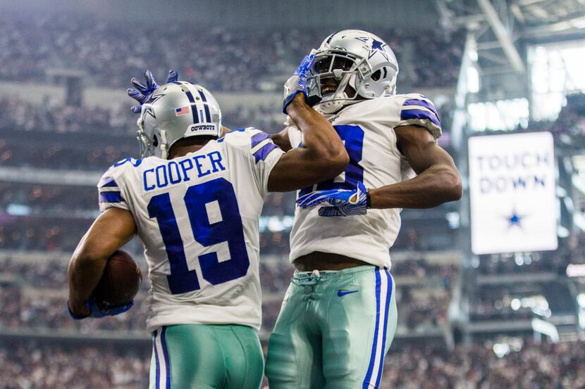 Dallas Cowboys wide receiver Amari Cooper (19) celebrates a touchdown with wide receiver...