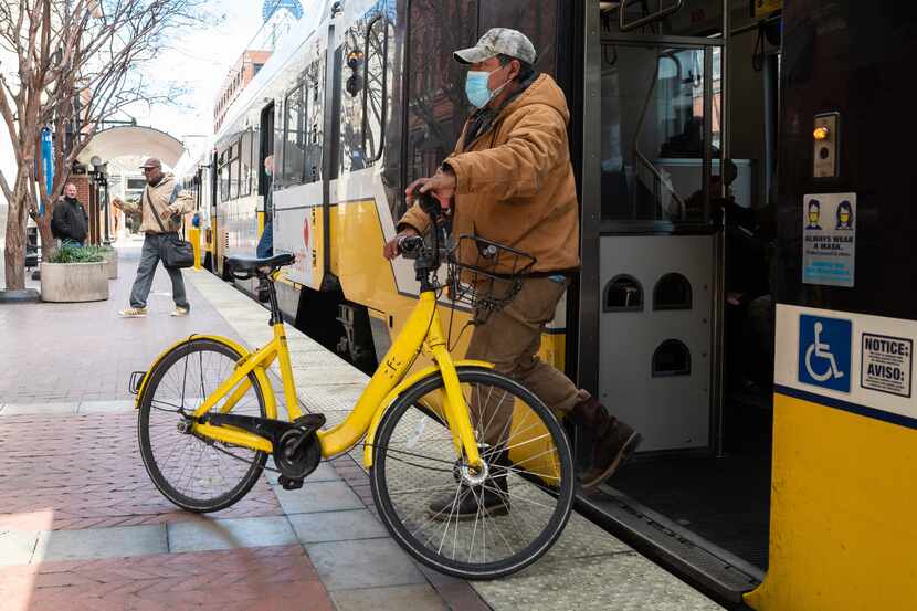 Mel Quesada Hernandez, 42, a construction worker from Lancaster, exits a DART train with his...