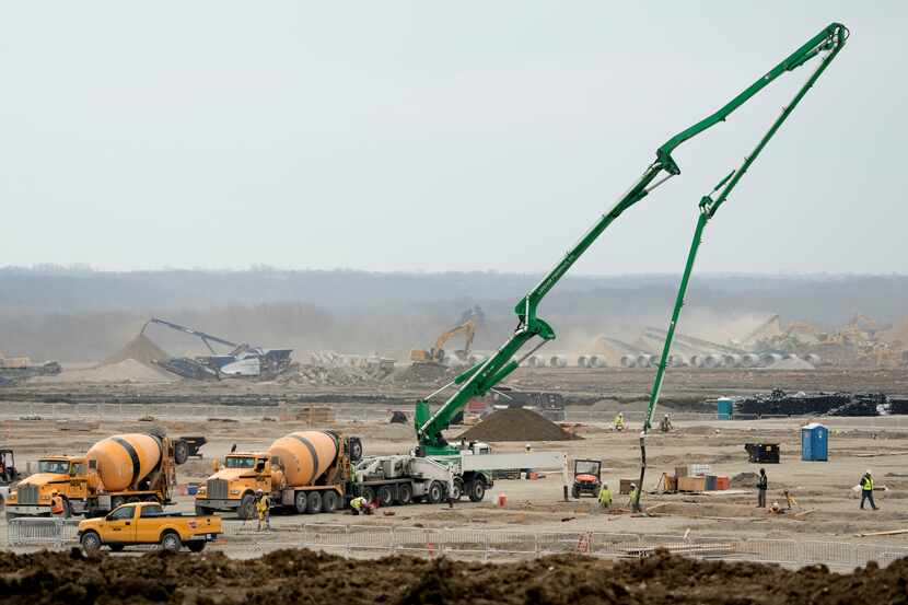 Workers prepare the site of a $4 billion Panasonic EV battery plant near DeSoto, Kan....
