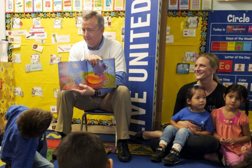 Tom Falk, CEO of Kimberly-Clark, read to students Tuesday at Mi Escuelita Preschool in...