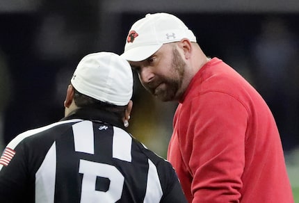 Melissa High School head coach Matt Nally questions a call during the first half as Melissa...