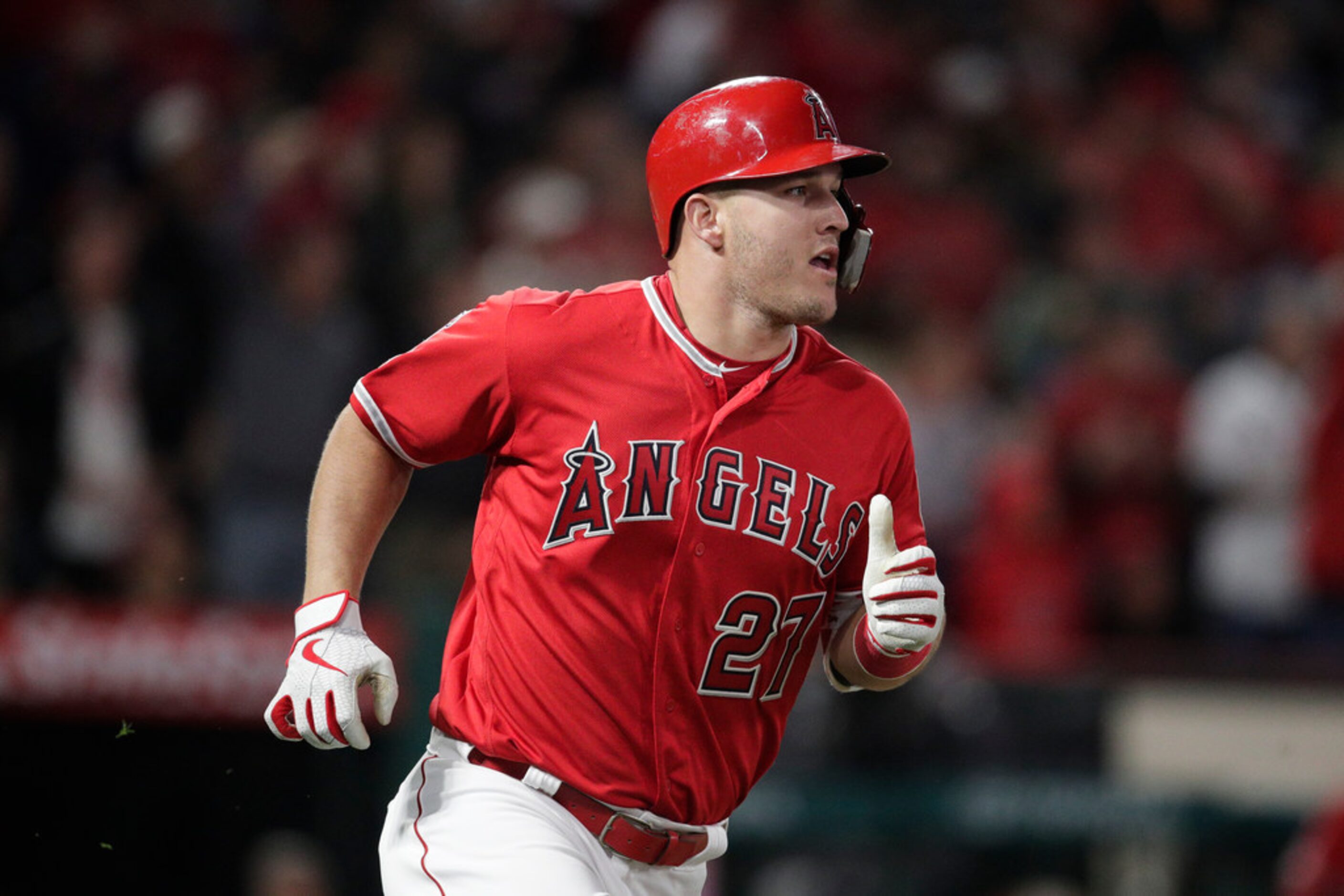 Los Angeles Angels' Mike Trout rounds the bases after hitting a home run during the sixth...