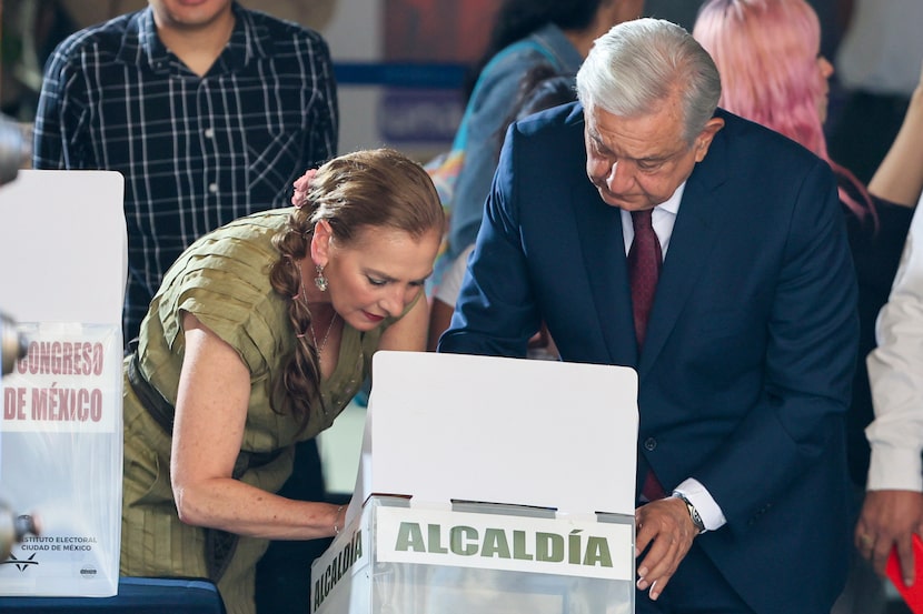 Outgoing President Andrés Manuel López Obrador and first lady Beatriz Gutiérrez Müller vote...