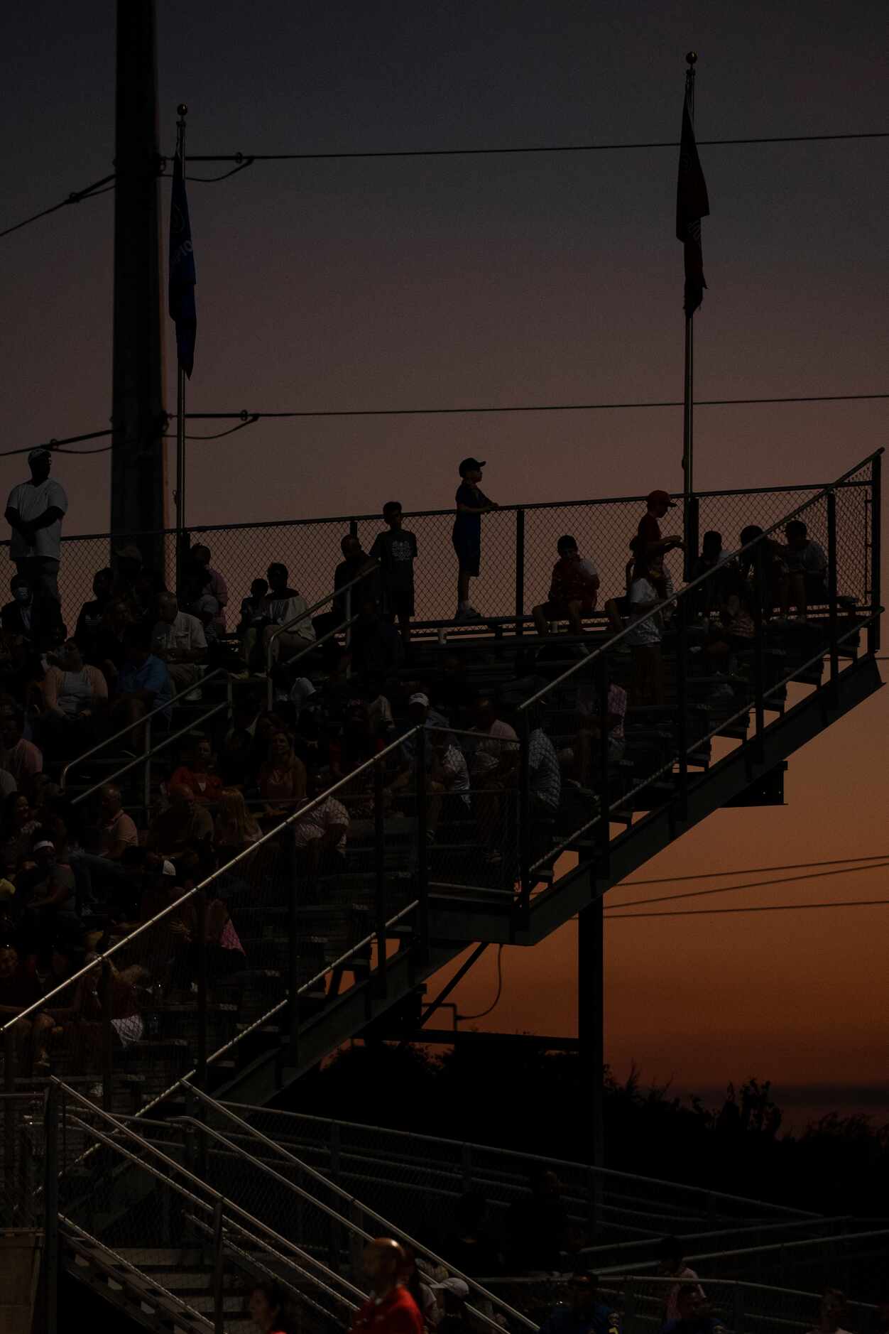 A fan watches the sun set during Parish EpiscopalÕs home game against Argyle Liberty...
