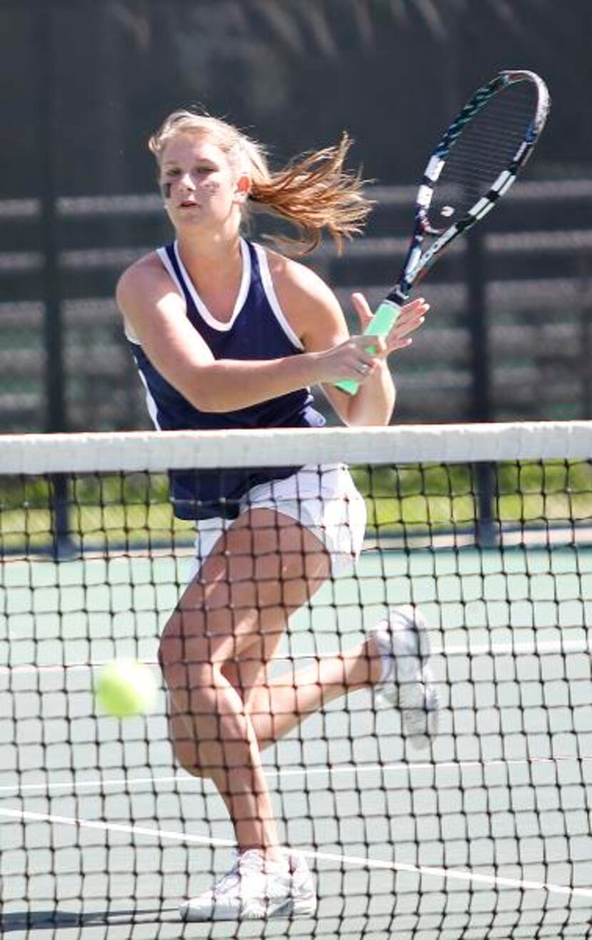 
Highland Park’s Margo Taylor hits a return during the girls doubles final. The junior has...