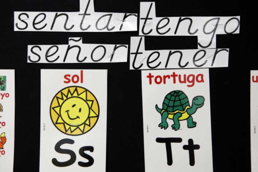 Signs written in Spanish are posted in a second-grade bilingual class at Farmers Branch...