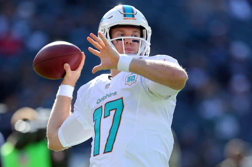 Miami Dolphins quarterback Ryan Tannehill #17 warms up before an NFL game against the...