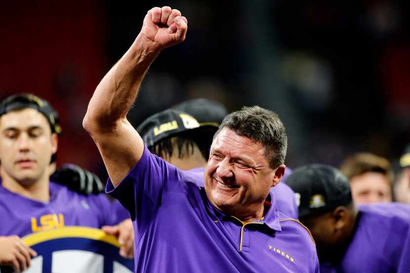 FILE - In this Dec. 7, 2019, file photo, LSU coach Ed Orgeron celebrates on stage after the...