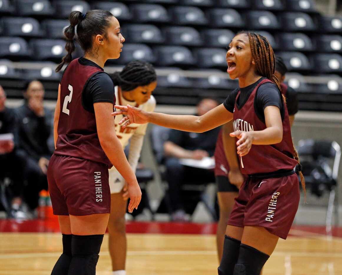 Princeton high guard Ashley Hart (2) and point guard Chandler Evans (1) realize they are...