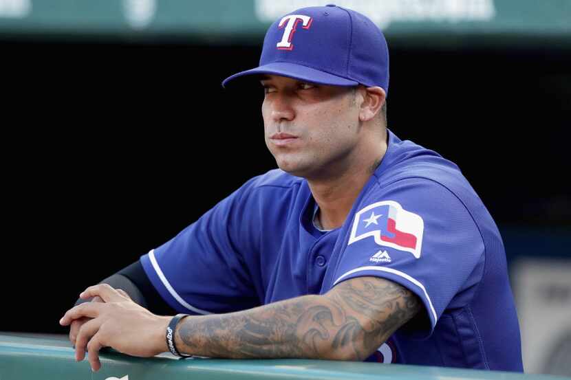 ARLINGTON, TX - MAY 13:  Matt Bush #51 of the Texas Rangers sits in the dugout before the...